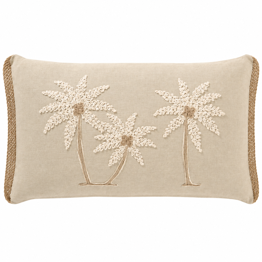 A rectangular beige throw pillow featuring embroidered palm trees in cream and tan, finished with a braided jute trim on the sides.
