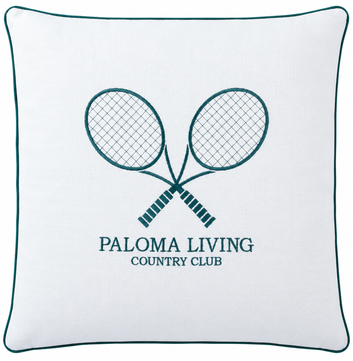A square white throw pillow with a dark teal border and a central embroidered design of two crossed tennis rackets above the text 'PALOMA LIVING COUNTRY CLUB'.